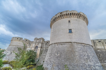 ruins of medieval old tower of castle under blue sky with cloud in Matera Italy