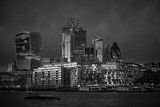 Fototapeta  - Black and white London cityline during sunset, beautiful example of contemporary modern archiecture, glass and steel on bank of Thames river in capitol of United kingdom.