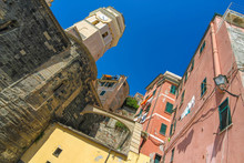 View Over The The Medieval Clock Tower Of Cinque Terre, Italy With Colourful Houses On A Sunny Day.