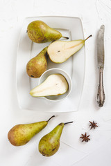 Wall Mural - Fresh pears in a dish on a white background