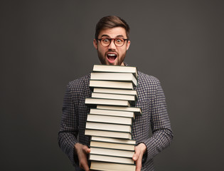 Wall Mural - Student with stack of books screaming