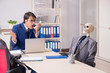 © Elnur - Funny business meeting with boss and skeletons