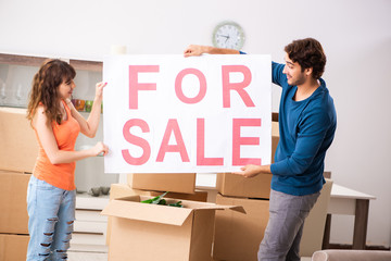 Young family offering house for sale and moving out