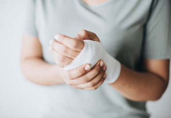 woman with gauze bandage wrapped around her hand