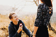 © Strelciuc - Cheerful man proposing to crop woman