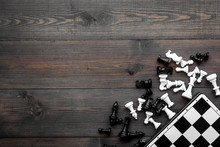 Competition Or Victory Or Strategy Concept. Chess Board And Chess Figures On Dak Wooden Background Top View Copy Space