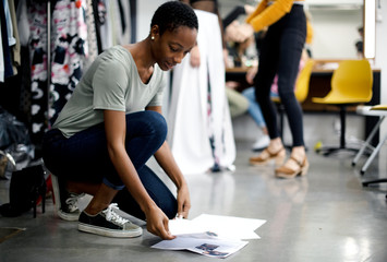 Stylist going through reference photos