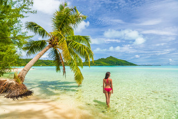 Vacation Luxury Travel woman walking on Tahiti paradise motu beach Bora Bora