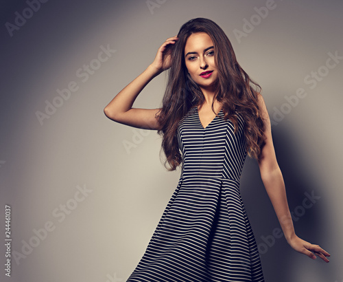 Makeup Sexy Woman With Long Curly Hairstyle Posing In Fashion