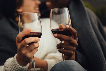 Wall Mural - couple having wine on picnic