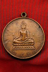 Old Buddha amulet.