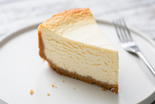 New York Cheesecake Slice On Plate. Closeup View. Tasty Smooth Cheesecake