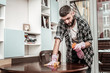 © Viacheslav Yakobchuk - Nice bearded man making his house clean
