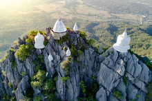 Spectacular Aerial View Of Floating Pagodas On The Mountain Cliff At Wat Chaloem Phra Kiat In Chae Hom District, Lampang Province, Thailand.