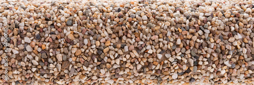 Fototapeta Small pebbles stones glued on the roll. Closeup
