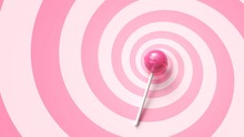 Sweet Lollipop On Stick On Pink Spiral Background