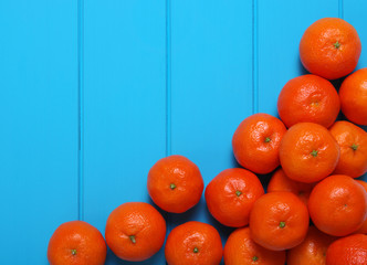 Wall Mural - Tangerine on wood table background