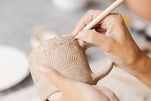 Close up of a woman making ceramic and pottery