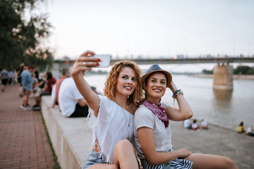 Wall Mural - Festival girls making a selfie.