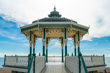 Brighton Pier Beach With Victorian Bandstand Octagonal Pavilion Chinese And Indian Style In The Background At Brighton Sussex, UK.
