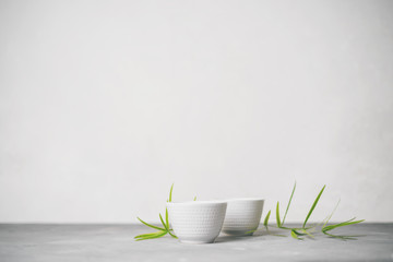 Asian food background set with  green tea cups with free space for text on white background.