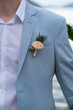 © bigguns - groom's boutonniere on the groom's jacket
