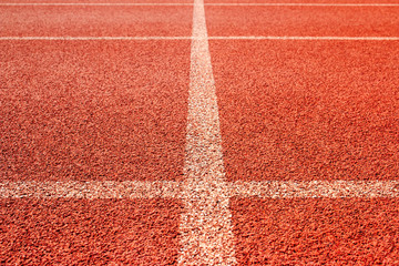 Wall Mural - Red running track Synthetic rubber on the athletic stadium.