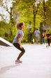 © BGStock72 - Young woman having exercise in the park