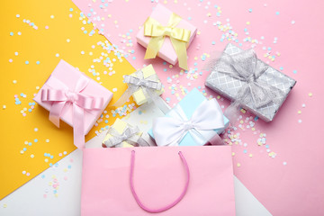 Poster - Shopping bag with gift boxes on colorful background