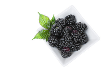 Closeup shot of fresh blackberries fruit solated on white background.Top view 