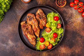 Roasted turkey steak with salad.