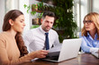 © sepy - Group of business people using laptop while working in the office