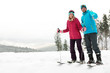 © New Africa - Couple of skiers on slope at resort, space for text. Winter vacation