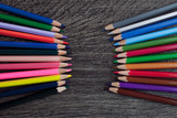 Fototapeta Tęcza - Coloured pencils isolated on the black background