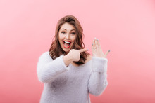 Excited Plump Woman Pointing At Engagement Ring