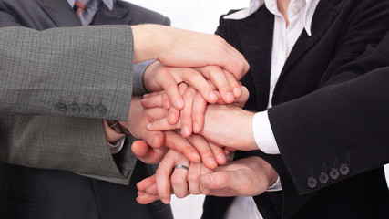 Wall Mural - group of business people with hands clasped together.