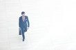 © ASDF - rear view from afar.a businessman with a leather briefcase