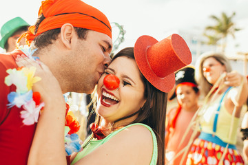 Brazilian Carnival. Couple in costume enjoying the carnival party in the city