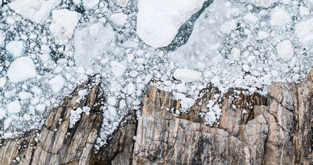 Wall Mural - climate change and global warming - icebergs drone aerial image top view. icebergs from melting glac