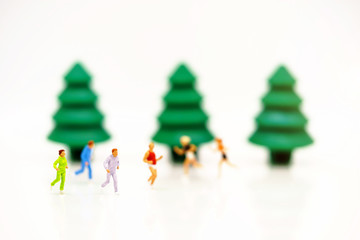 Wall Mural - Miniature people running forward. Target and growth in business concept.