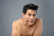 © Atstock Productions - Portrait of shirtless young handsome Asian man touching his face