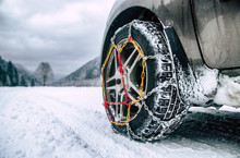 Snow Chains On Tire At Winter Road