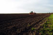 Farmer seeding crops at field. - Image