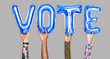 © Rawpixel.com - Hands holding vote word in balloon letters