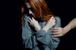 © Photographee.eu - Helpful hand put on scared young redhead woman's arm as a symbol of support