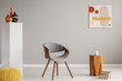 © Photographee.eu - Trendy grey and wooden chair in retro living room interior