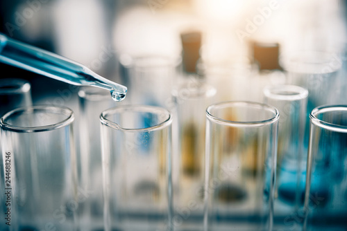 Fotomural Test tube containing chemical liquid in laboratory, lab chemistry or science research and development concept