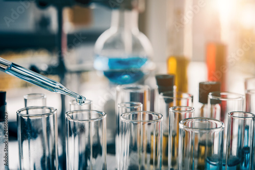 Fotomural Test tube containing chemical liquid in laboratory, lab chemistry or science research and development concept