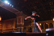 © ADDICTIVE STOCK - Young dancer performing on stage in restaurant