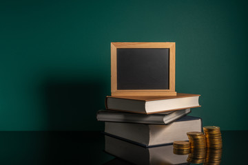 Wall Mural - Chalkboard and stalking books with low light